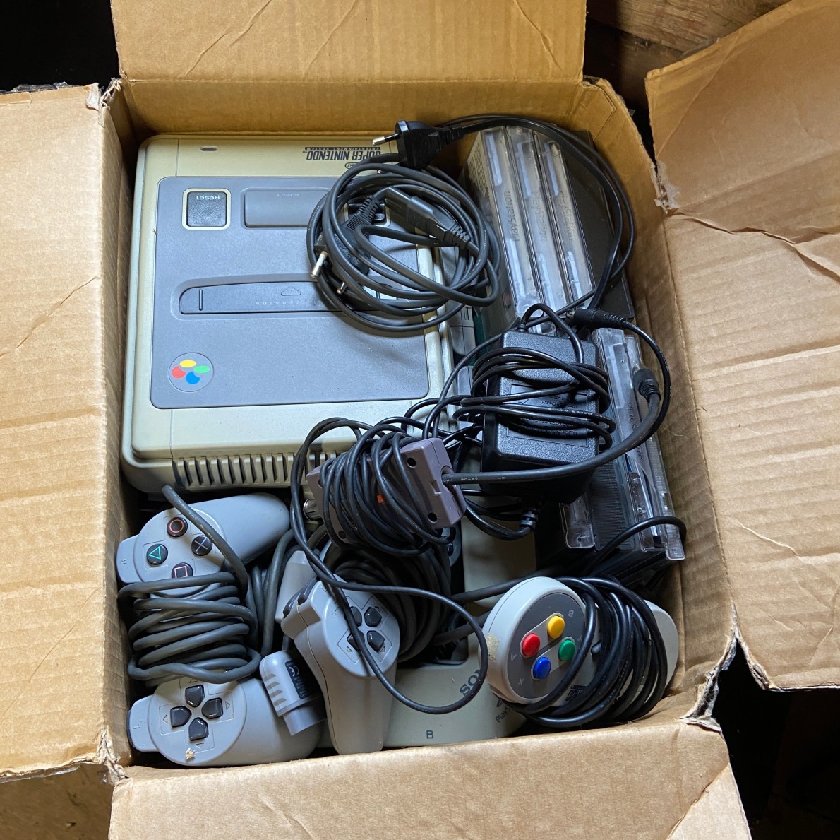 A photo of my Snes console in a card board box